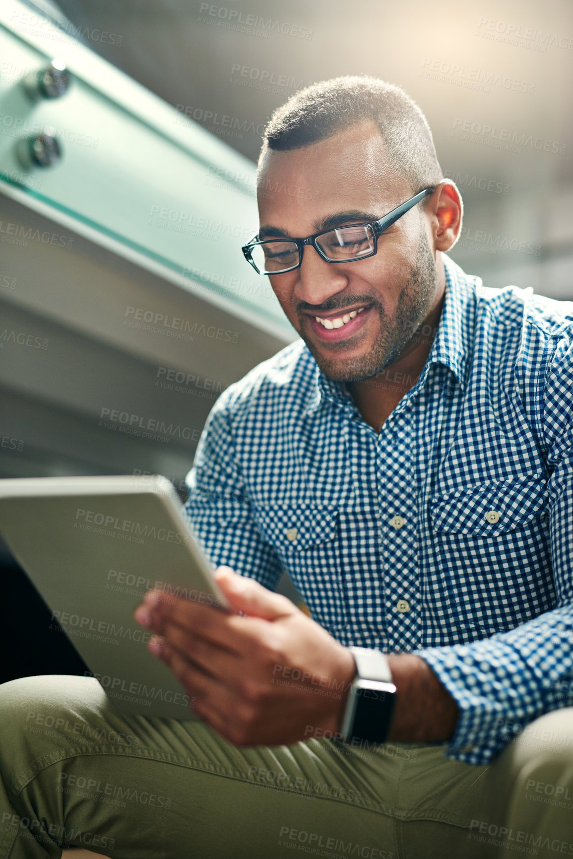 Buy stock photo Black man, reading and tablet in office with smile, career and social media management for company. Professional, creative and male person with ebook for research with email marketing, happy and post