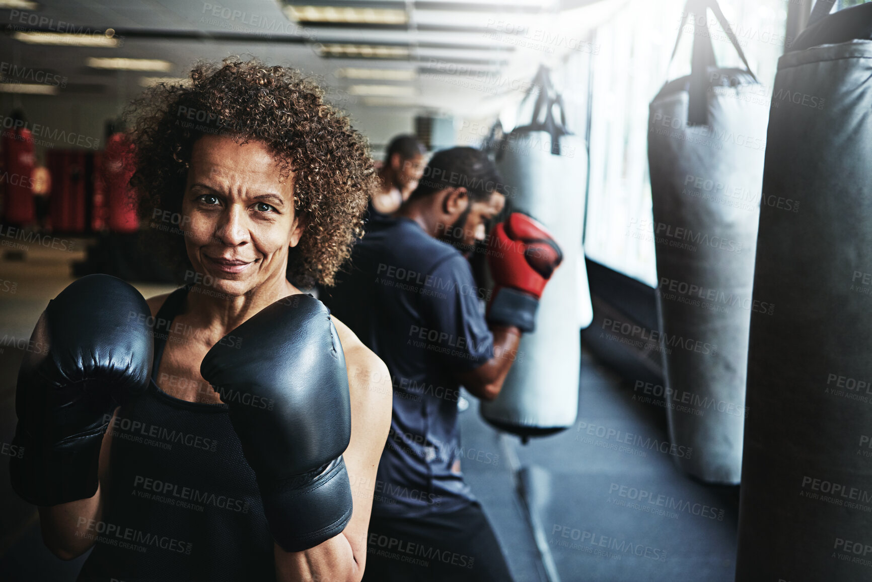 Buy stock photo Shot of young athletes working out in the gym