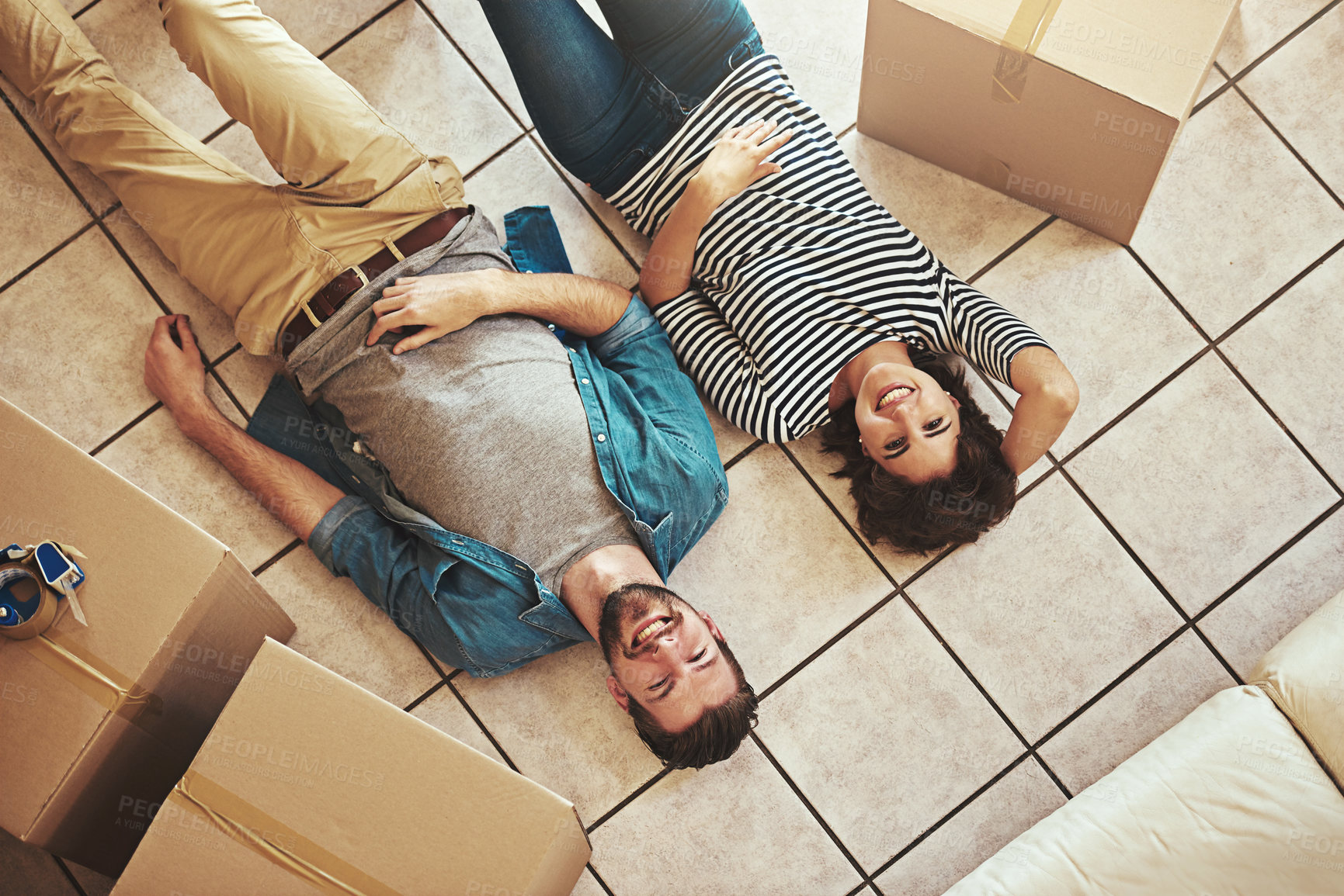 Buy stock photo Relax, portrait and couple with box in new home for real estate, relocation and property investment. Top view, woman and man with cardboard in house for marriage residence,  love and moving in Canada