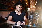 Accessing the best cafe management apps right from his phone