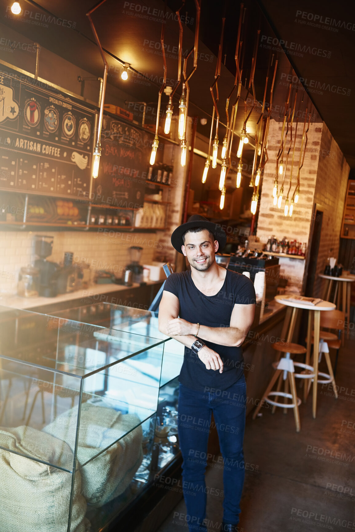 Buy stock photo Counter, coffee shop and portrait of man in cafe ready for serving caffeine, drinks and beverage for small business. Restaurant, hospitality and confident person for barista service, help or welcome