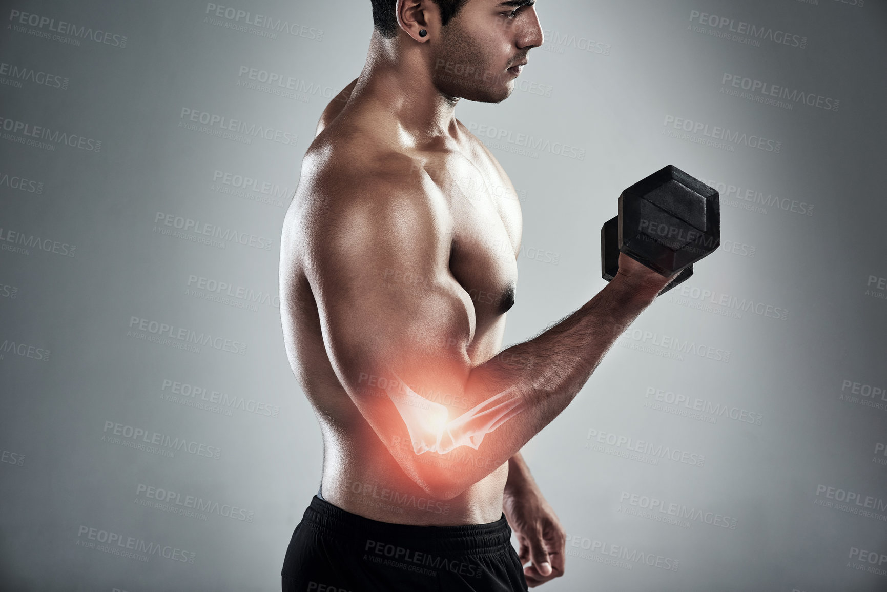 Buy stock photo Man, dumbbell and elbow injury in studio, profile and bone for weightlifting, power or health by white background. Person, bodybuilder and red glow for pain, overlay and accident for joint in workout