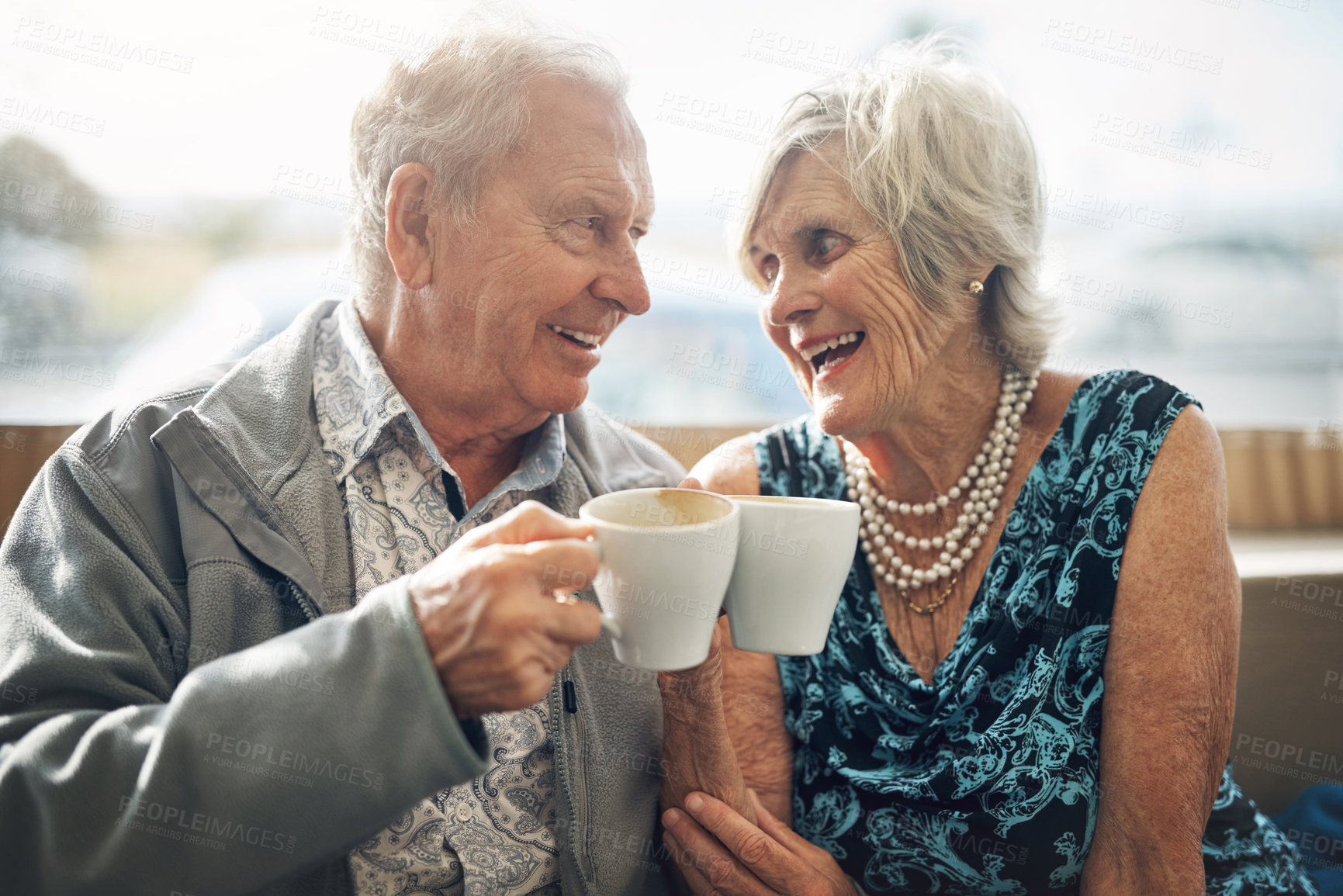 Buy stock photo Coffee, cheers and senior couple on date, laughing and conversation of past, love and retirement. Commitment, woman and man with cup, happy and talking of marriage, together and break in weekend

