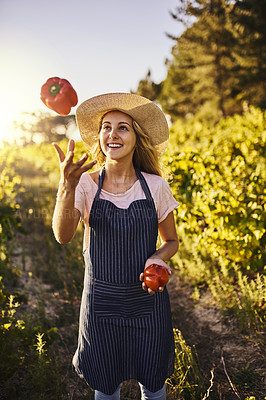 Buy stock photo Woman, throw and vegetables in countryside for health, nutrition and sustainable diet. Farmer, red pepper and happy for gardening, agriculture and vegan or eco friendly food and growth in nature