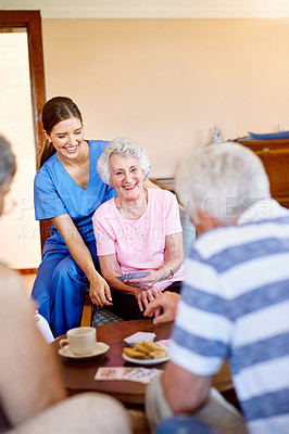 Buy stock photo Women, caregiver and senior patient with playing cards for games, fun and happy at nursing home. People, nurse and laugh with bonding for care, support and trust in healthcare for entertainment