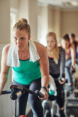 Buy stock photo Cycling class, fitness instructor and women riding exercise bikes together for cardio training and teamwork. Tired, female people and health for workout progress with coach for challenge and support