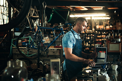 Buy stock photo Bicycle, small business and clipboard of man, shop and garage of mechanic, apron and equipment. Reading, owner and person with service, maintenance and tools for bike, technician and working in store