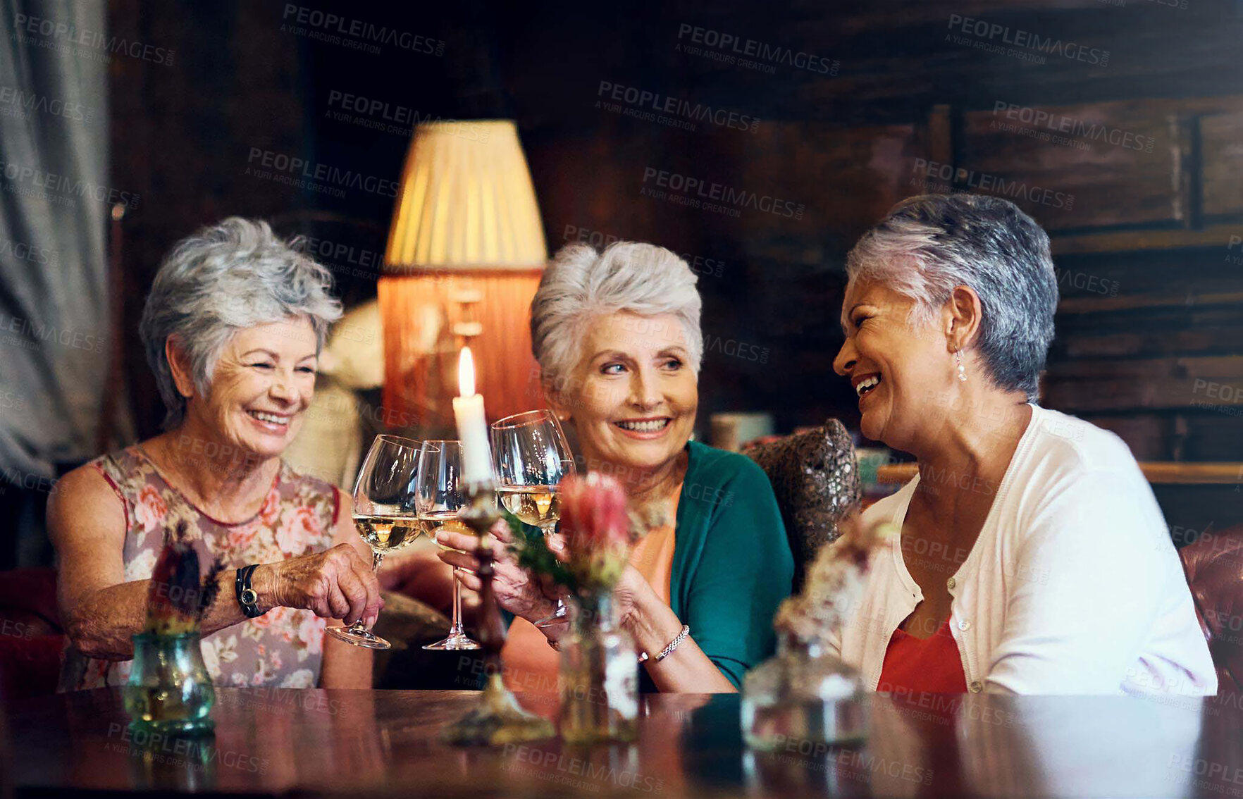 Buy stock photo Cheers, wine and smile with elderly friends in home for bonding, laugh and relax. Retirement, celebration and happiness with group of senior people with drink for social, memory and support together