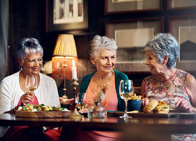 Buy stock photo Senior woman, friends and food in restaurant for wine, vacation and retirement together with happy. Elderly people, reunion and relax in diner for drinks, holiday and social celebration with memory