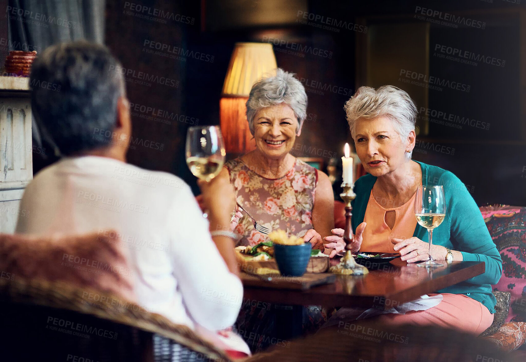 Buy stock photo Conversation, wine and smile with elderly friends in home for bonding, laugh and relax. Retirement, celebration and happiness with senior people and lunch for social, memory and support together