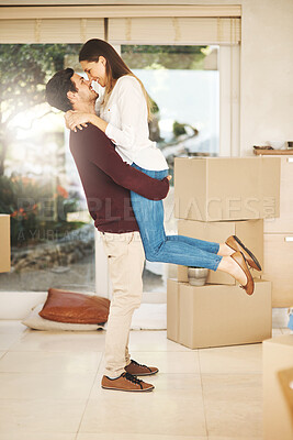 Buy stock photo Box, happy and couple with hug in new home for mortgage, investment and celebration of purchase. Man, woman and love with embrace in living room for real estate, support and growth in marriage