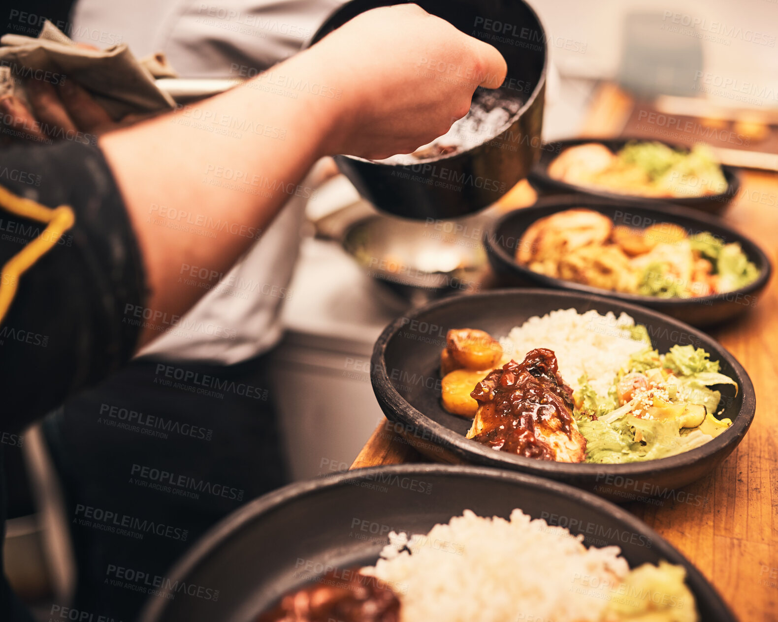 Buy stock photo Chef, plate and hands in kitchen with healthy food, dish and preparation on table in hospitality service. Professional meal prep, person and cooking at diner for order, dining and culinary experience