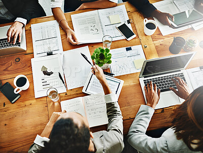 Buy stock photo High angle shot of a group of businesspeople having a meeting in an office