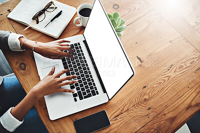 Buy stock photo High angle shot of an unrecognizable businesswoman working on a laptop in an office