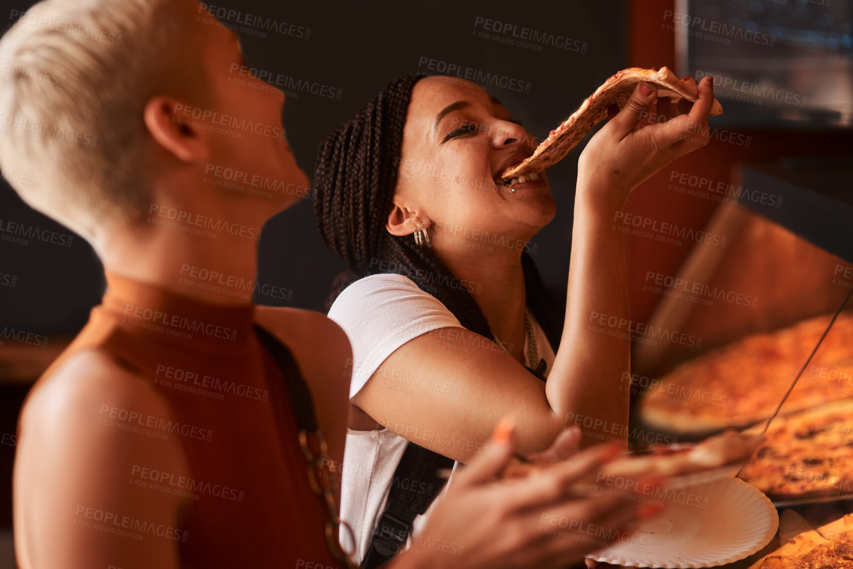 Buy stock photo Pizza, friends and women eating food at a restaurant with order and hungry at lunch with takeaway. Customer, dinner and happy people together with bonding and smile at a diner with meal or funny bite