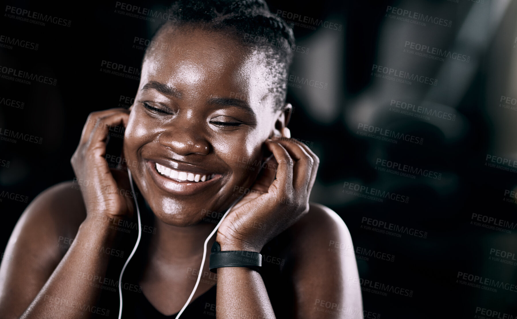 Buy stock photo Radio, workout and black woman in gym for cardio, exercise and fitness training with earphones for wellness audio. Podcast, bodybuilder and african lady for health or smile, happy or excited by music