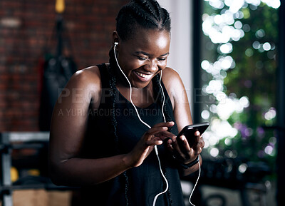 Buy stock photo Radio, fitness and black woman in gym for cardio, exercise and workout training with earphones for wellness audio. Podcast, bodybuilder and african lady for health or smile, happy or excited by music