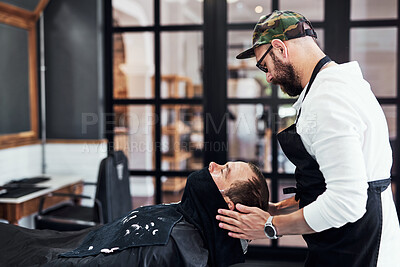 Buy stock photo Beard, client and man in barbershop with facial, shave and tools for trendy hairstyle at small business. Style, barber and customer in chair for grooming service, creative haircut and hair care.