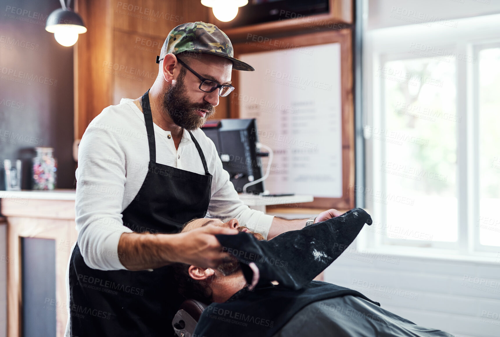 Buy stock photo Man, customer and beard care in barbershop, wash and trim or neat facial line up for client in all purpose chair. Appointment, maintenance and clean up with male person, wellness and relaxing