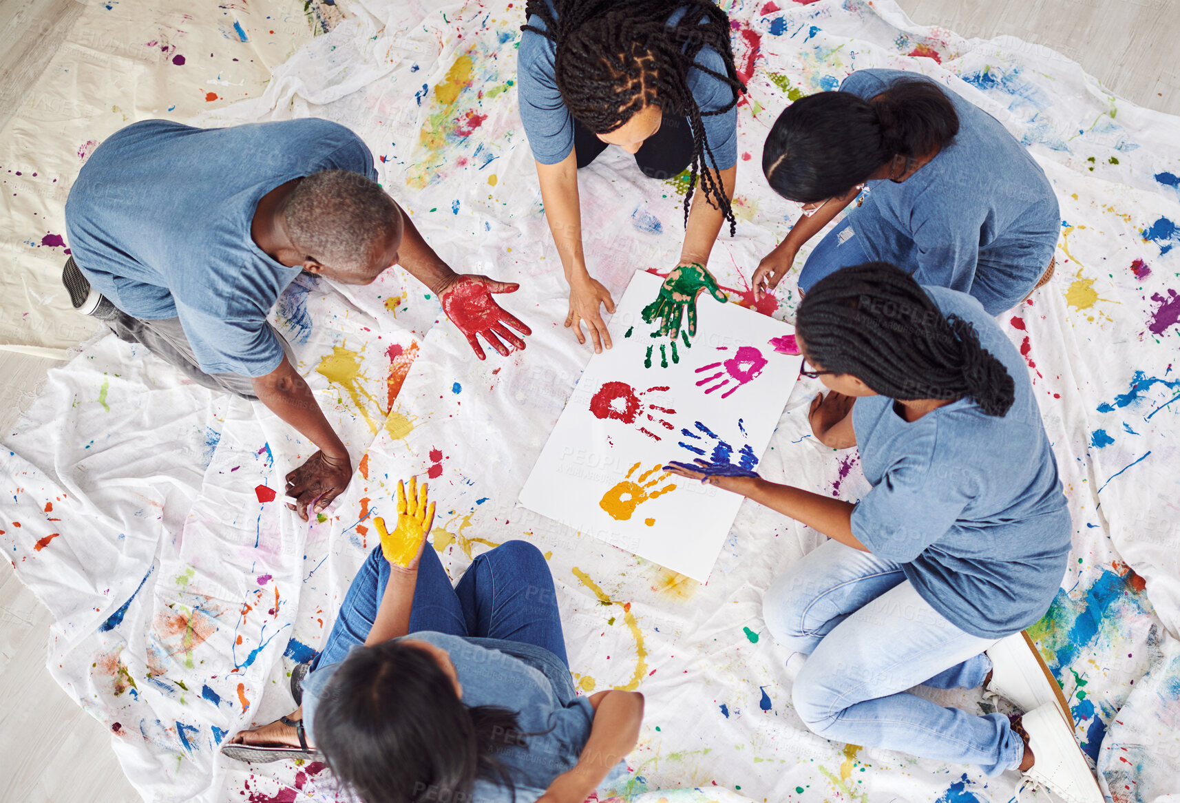Buy stock photo Handprints, painting and students with paper, art and above on floor, people and creative with palm. Workshop, artist and  painter in group, inspiration and unity for poster, solidarity or expression