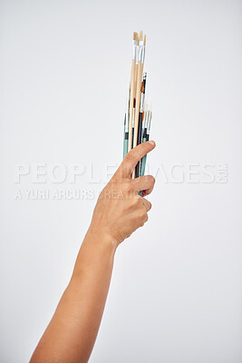 Buy stock photo Hand, paintbrush and creative artist in studio or watercolor tools for canvas project, creator or white background. Person, fingers and student workshop or crafts equipment, hobby or mockup space