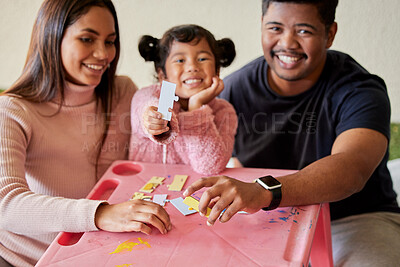 Buy stock photo Parents, girl and portrait in home with puzzle, learning and development for care, love and bonding. Father, mother and daughter for games, teaching and problem solving at family house in Bogota