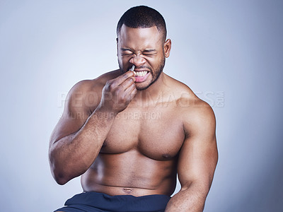 Buy stock photo Black man, tweezers and nose hair in studio, grooming and plucking for epilation on blue background. Male person, skincare and maintenance for hygiene routine or cleaning, beauty and facial cosmetics