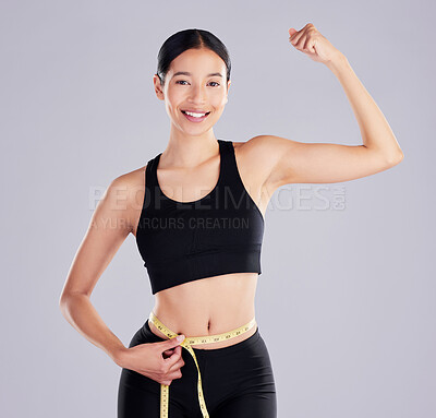 Buy stock photo Woman, stomach and happy with tape measure in studio on white background for for progress, weight loss and fitness. Portrait, exercise and workout with smile for bicep or muscle flex and positivity