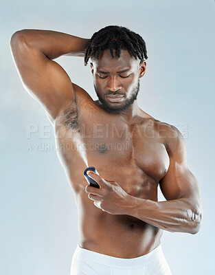 Buy stock photo Black man, body and spray armpit with deodorant in studio isolated on background. Underarm, perfume and model with fragrance for hygiene, clean and grooming for health with fresh skincare cosmetics