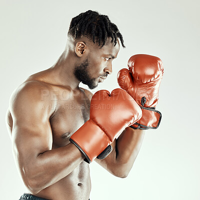 Buy stock photo Fitness, black man and boxing with gloves in studio for competition, strength challenge or self defence training on white background. Profile, power and athlete for muscle, champion or cardio workout