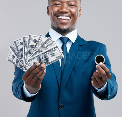 Buy stock photo Businessman, cash and coin in portrait smiling for crypto currency or financial security on studio grey background. Black male person, money and happy in suit for investment, payment or blockchain