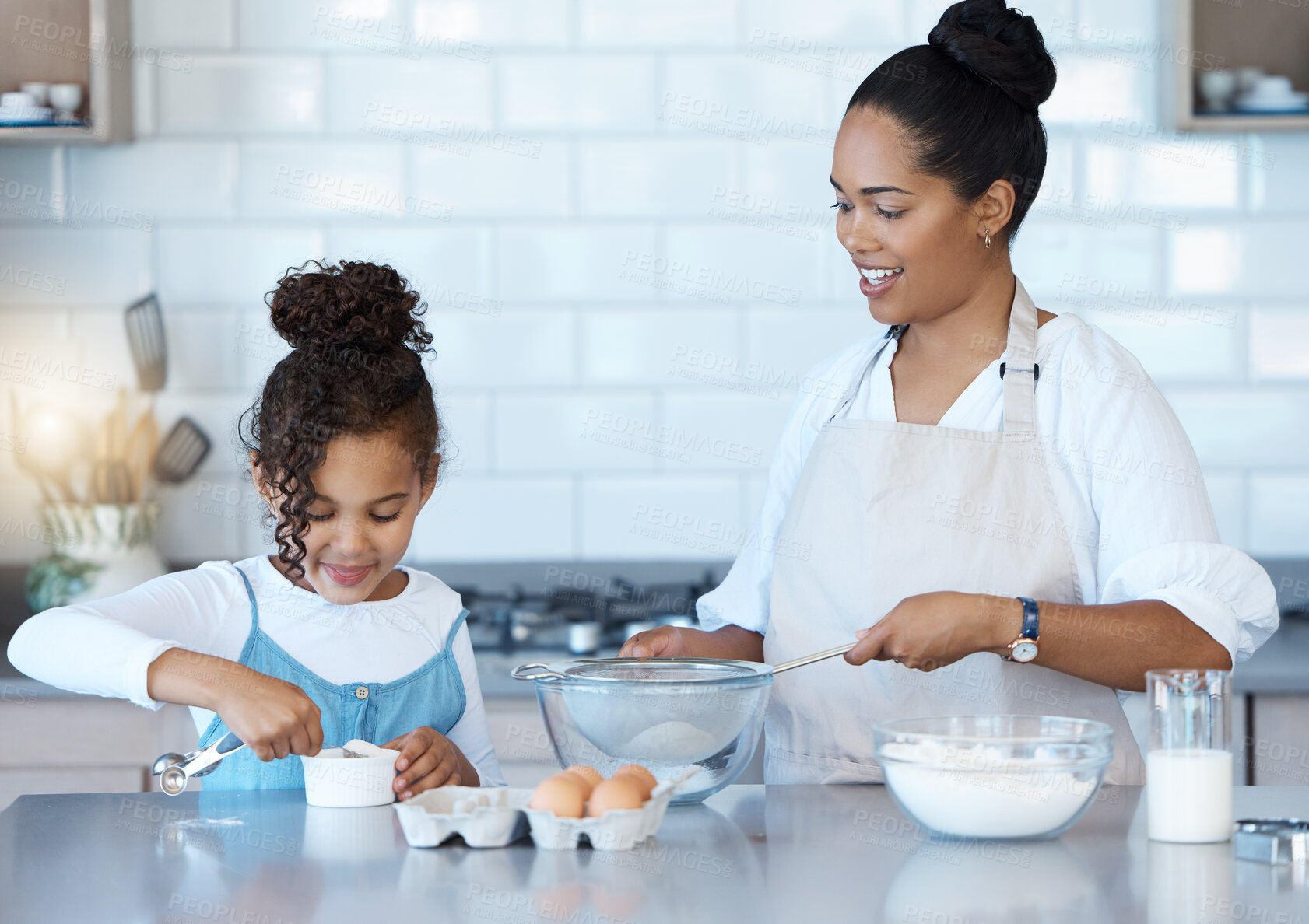 Buy stock photo Learning, mother and child baking in kitchen for family bonding, love and care together. Mom, happy girl and teaching kid cooking food with flour, eggs and sugar to help with dessert recipe in home