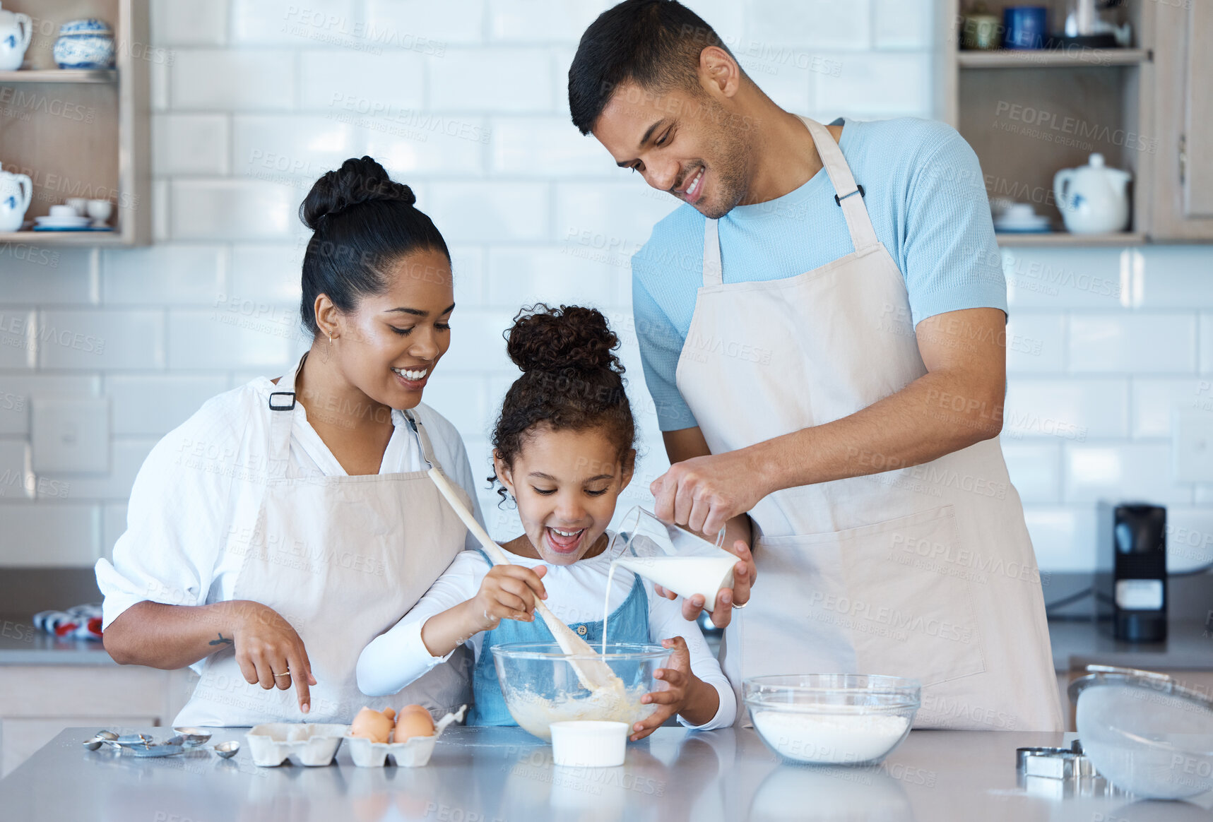 Buy stock photo Learning, family and child baking in kitchen for bonding with parents together in home. Mother, father and teaching kid cooking food with flour, eggs and milk to help happy girl with dessert recipe