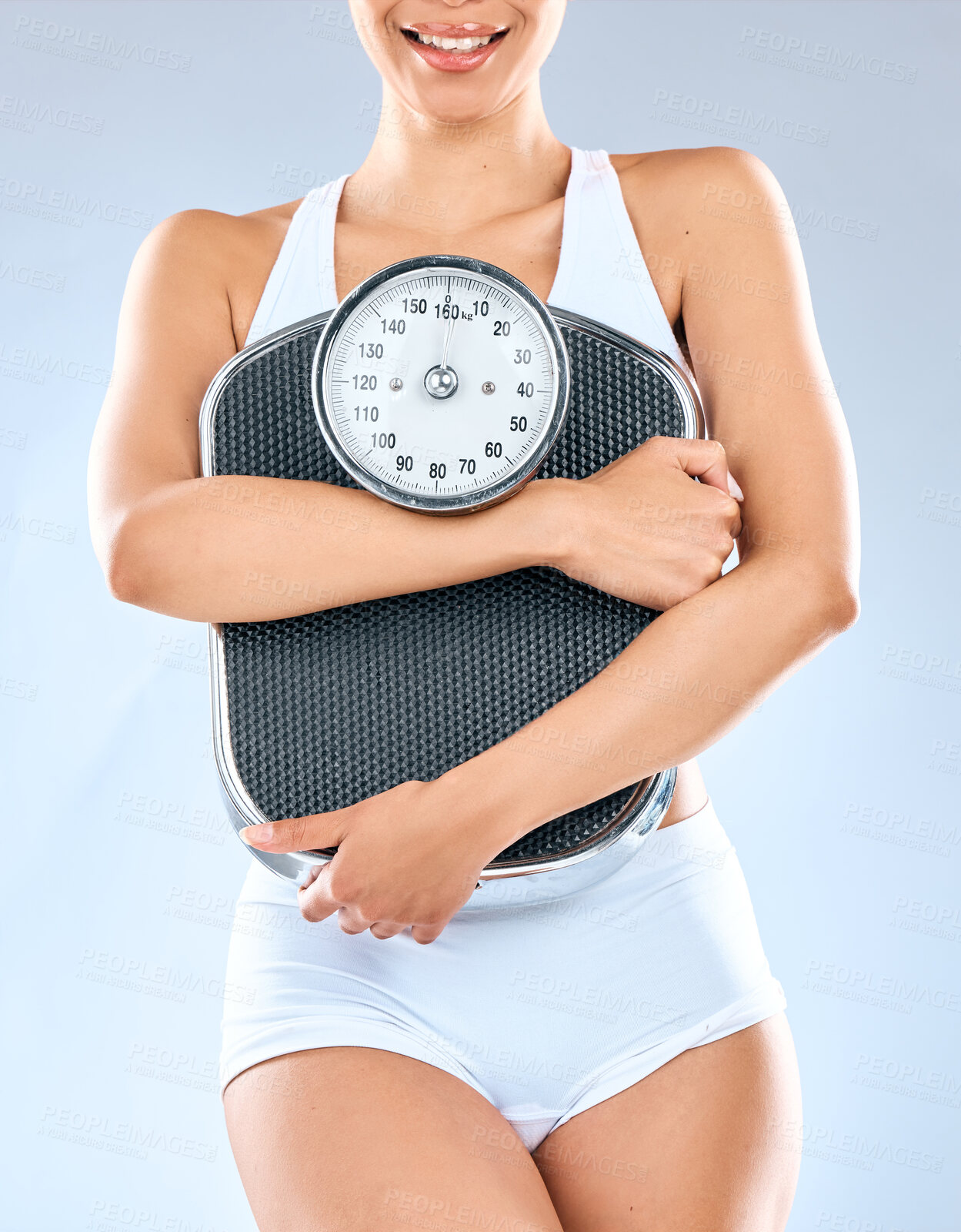 Buy stock photo Girl, studio and holding scale for weightloss tracking, progress and weighing for health or nutrition for slim body. Woman, isolated and white background for fitness goal or target, measure and diet.