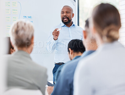 Buy stock photo Meeting, whiteboard and black man speaking for presentation with business workshop and project proposal in office. African entrepreneur, guy talking and coaching for training employees with explain