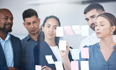 Buy stock photo Sticky note, glass wall and business people in office with collaboration for planning strategy. Design staff, writing notes and moodboard with brainstorming ideas for seo project and problem solving