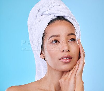 Buy stock photo Woman, skincare and clear skin in studio for beauty, facial treatment and blue background. Female person, cosmetics and grooming routine after shower, dermatology and self care pamper for wellness