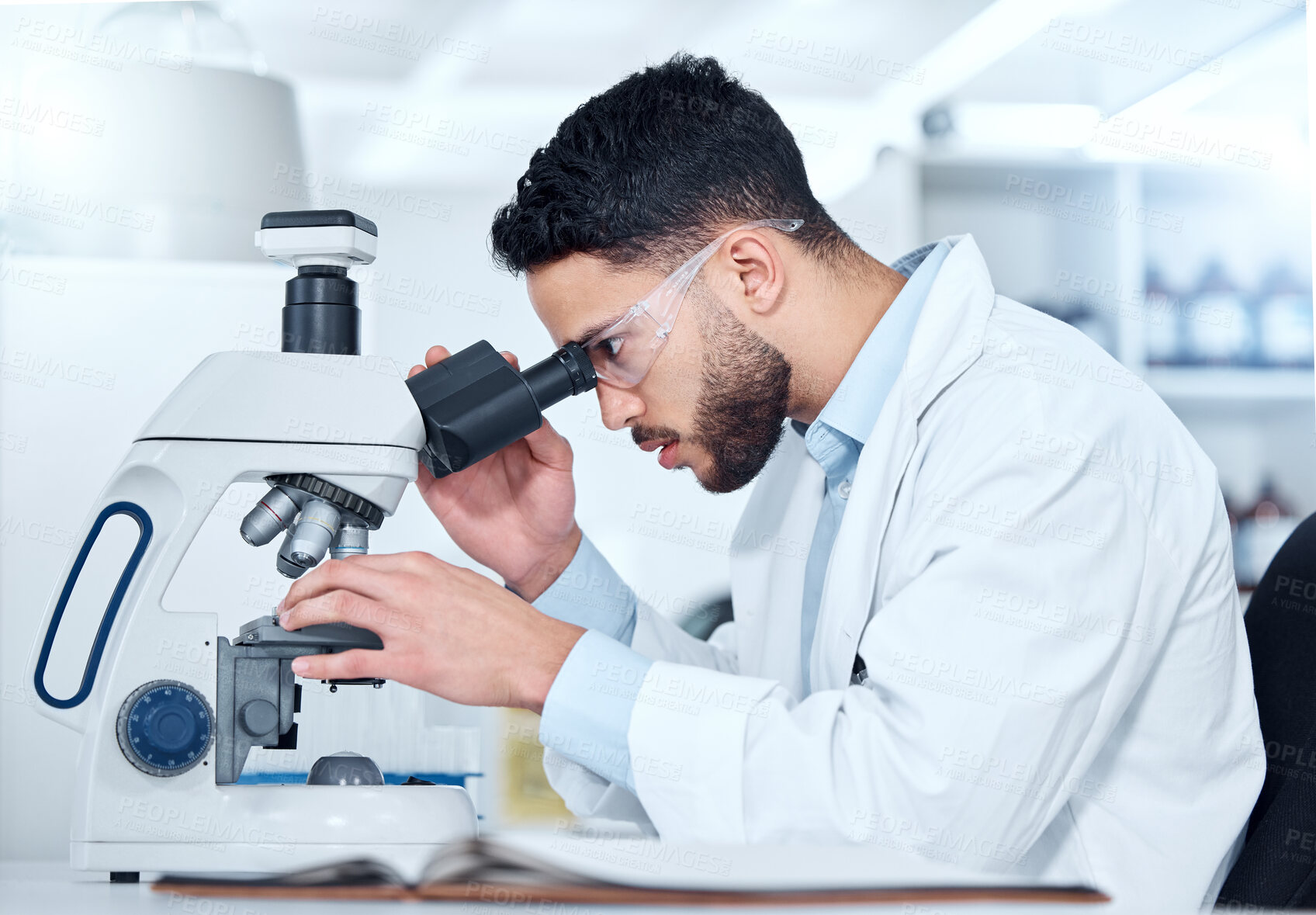 Buy stock photo Man, microscope and examine research in laboratory, biochemist and innovation healthcare study with virus sample. Investigation, cure development and science or breakthrough, medical and equipment
