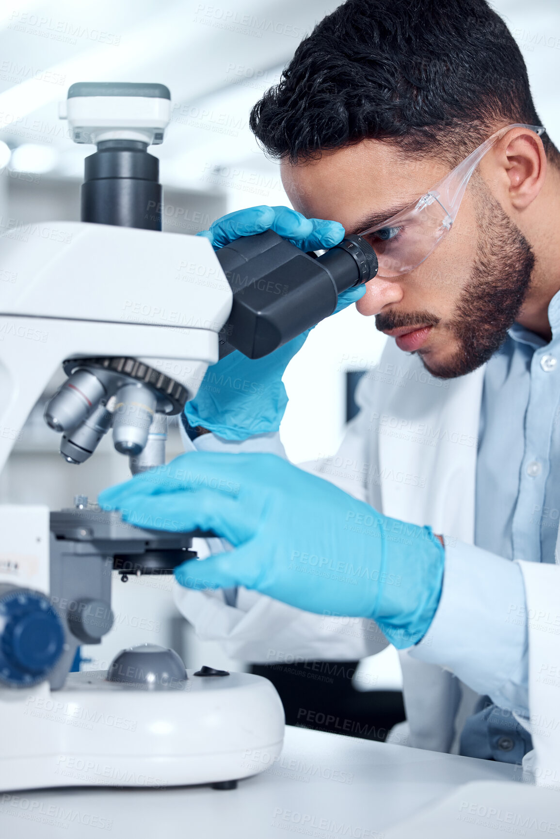 Buy stock photo Man, microscope and research analysis in lab, biochemist and innovation healthcare study with virus sample. Investigation, cure development and breakthrough, medical and goggles with professional