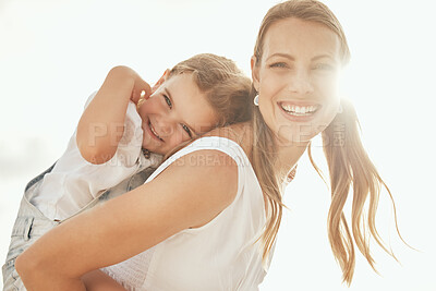 Buy stock photo Mother and daughter, portrait and beach sunset for piggyback love, trust and support or bonding in nature. Travel, family and face of mom with kid at the ocean for back ride fun, adventure or games