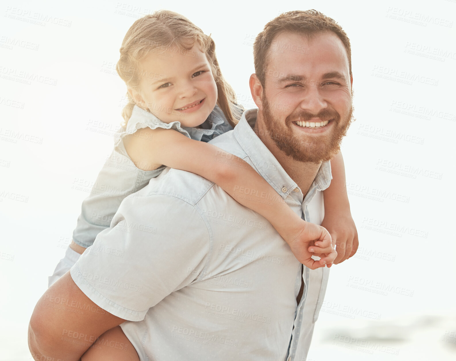 Buy stock photo Portrait, father and daughter at beach for piggyback love, trust and support, safety and bonding in nature. Travel, family and face of dad with kid at the ocean for back ride fun, adventure or games