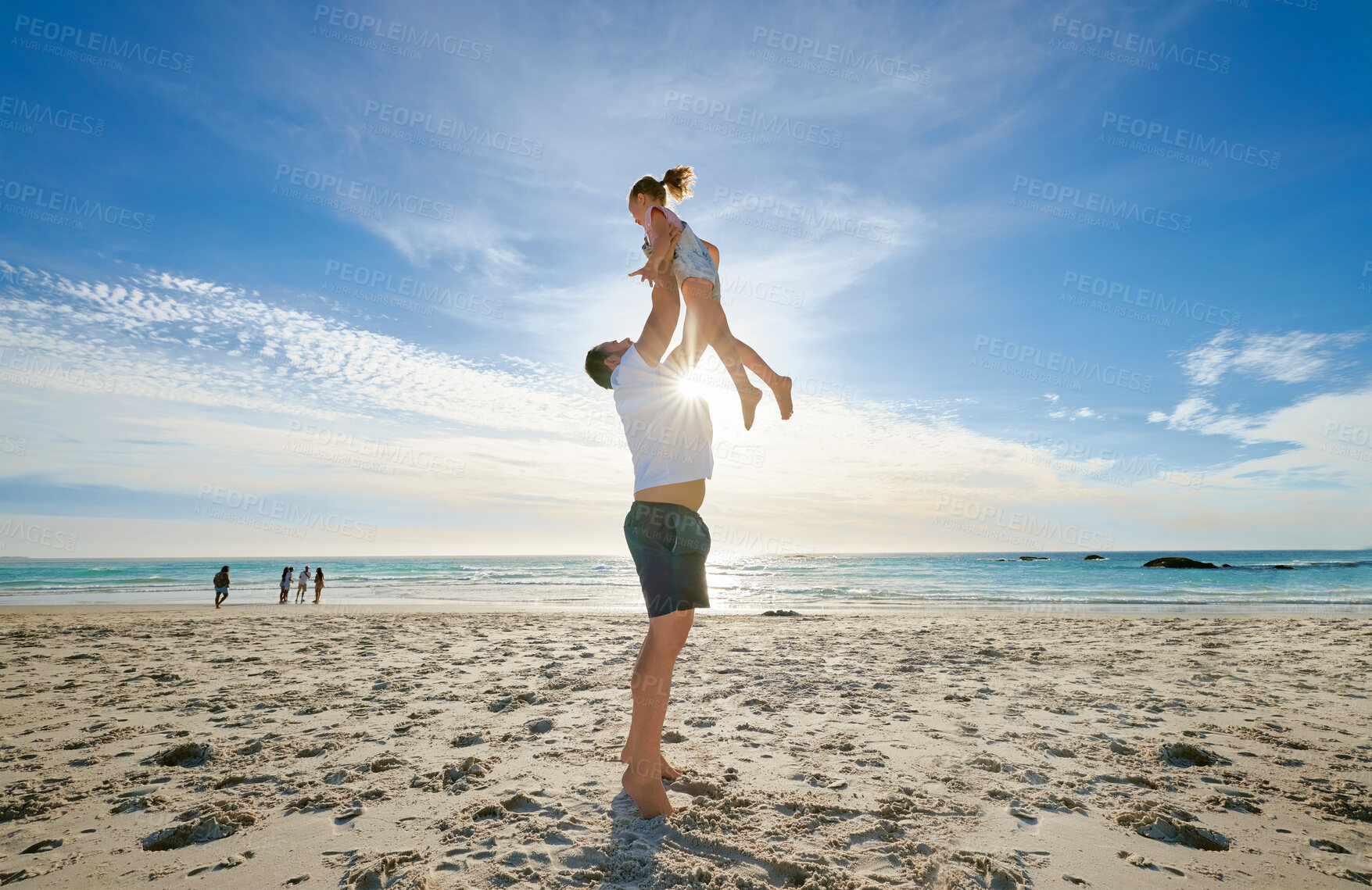 Buy stock photo Beach, man holding girl in air and playful for vacation, weekend break and summer. Father lifting daughter, relax and bonding at seaside, holiday and loving together for time outdoor with happiness