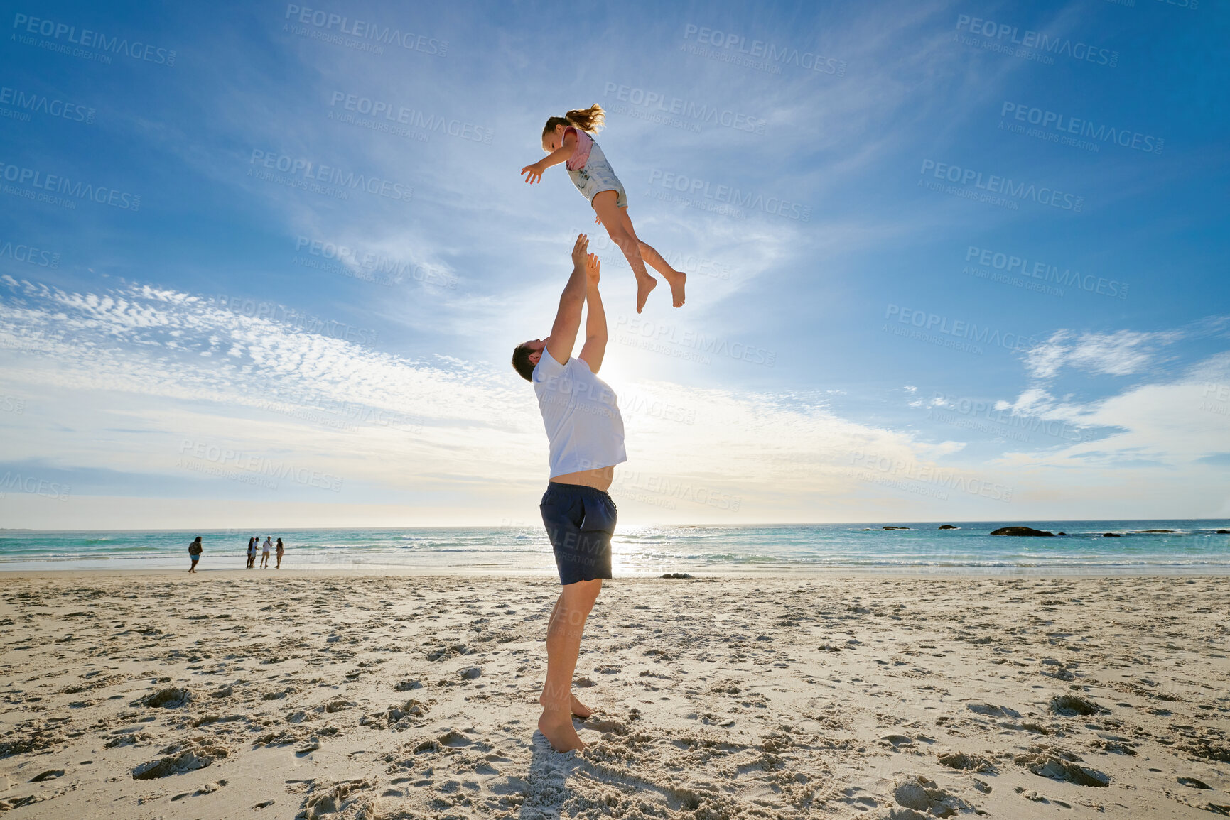 Buy stock photo Beach, man holding girl in air and playful for vacation, weekend break and nature. Father swing daughter, relax and bonding at seaside, holiday and loving together for quality time, outdoor and smile