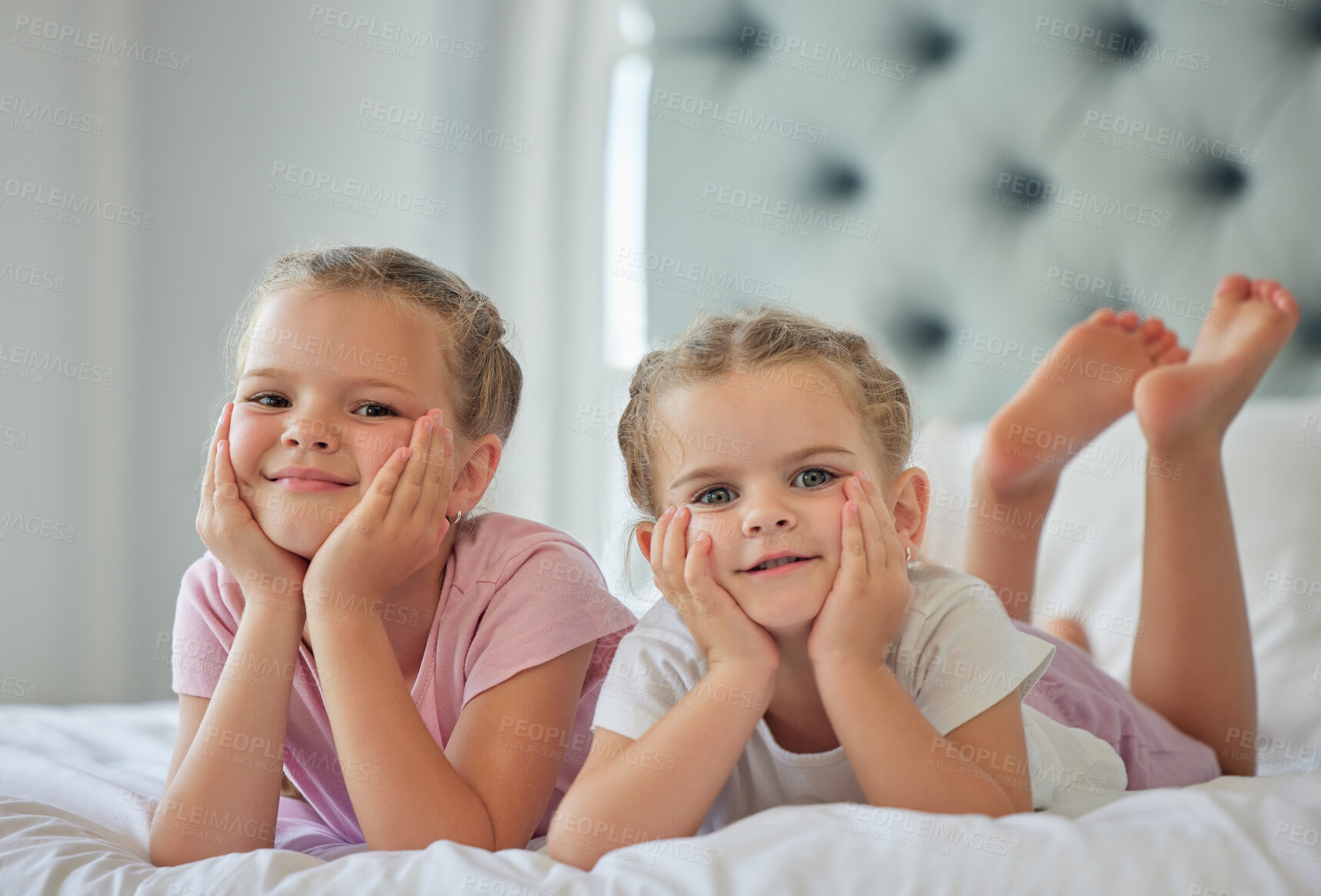 Buy stock photo Sisters, kids and portrait to relax in bedroom, morning and wake up together in home. Girls, children and weekend for lying on bed or bonding for relationship, support and peace in security of unity