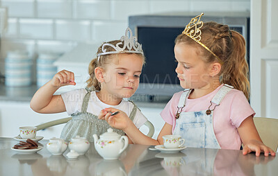 Buy stock photo Girl, children and playful in kitchen with tea party for childhood fun, cookies and tiara for pretend. Kids, siblings and toys in home together with love or care, bonding and growth or development.