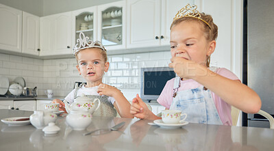 Buy stock photo Girl, children and portrait in kitchen with tea party for childhood fun, cookies and tiara for pretend play. Kids, siblings and toys in home with happiness or love, bonding and growth or development.