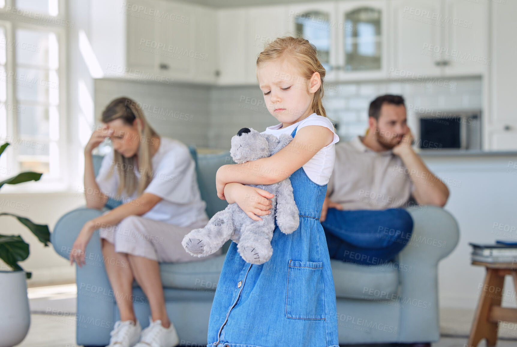 Buy stock photo Divorce, father and mother separation with teddy bear in living room, custody and sad girl. Parents, mama and dad by daughter, female child holding toy and family frustrated for problem at home