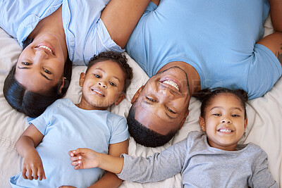 Buy stock photo Mexican family, top view and portrait on bed for love, smile and connect or security in home for bonding. Parents, children and relax in bedroom on morning for peace, wake up and together for support