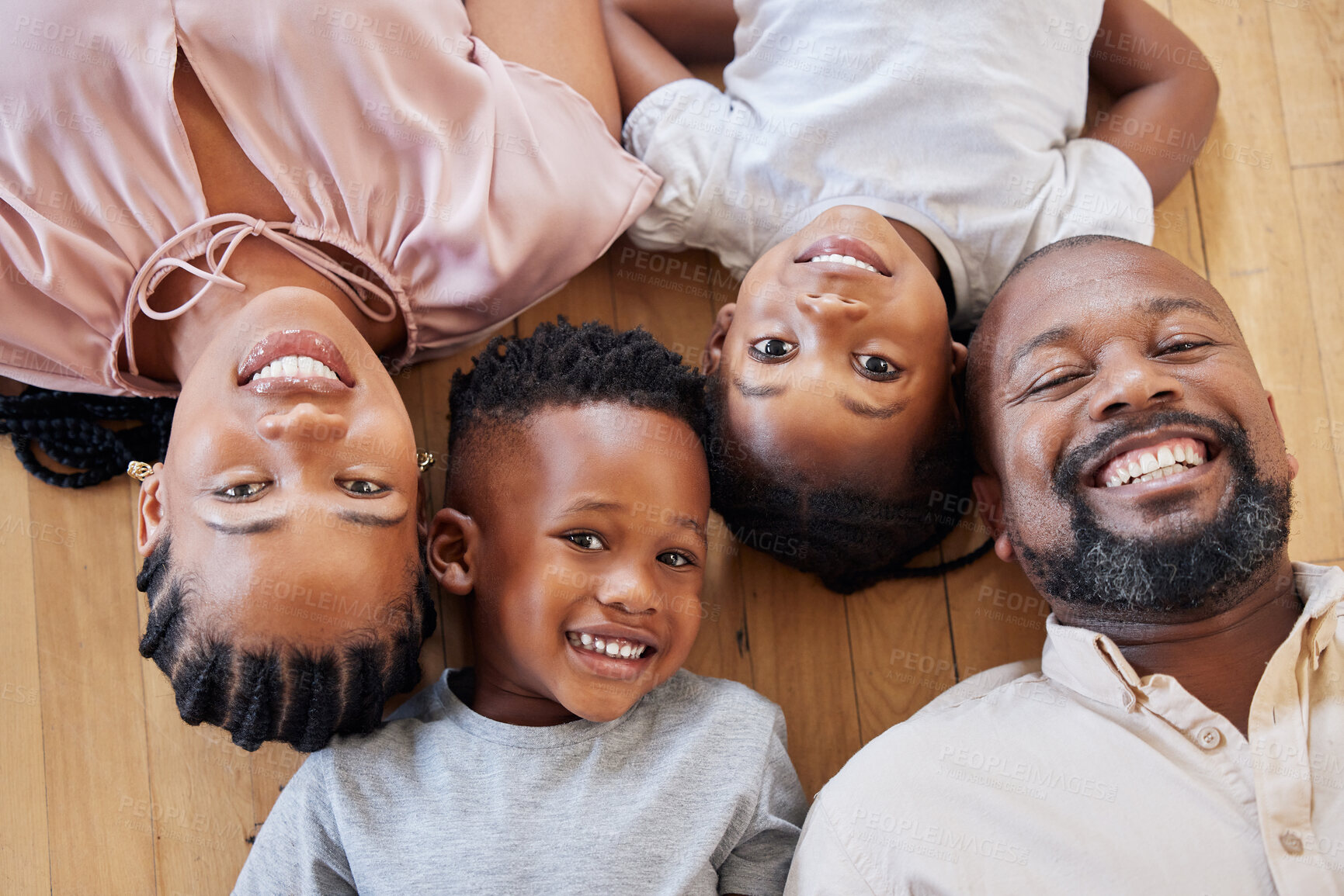 Buy stock photo Black family, portrait and children on floor with support for bonding, relationship or relax together. Top view, young kids and man parent with woman for care, love or happiness in home on weekend