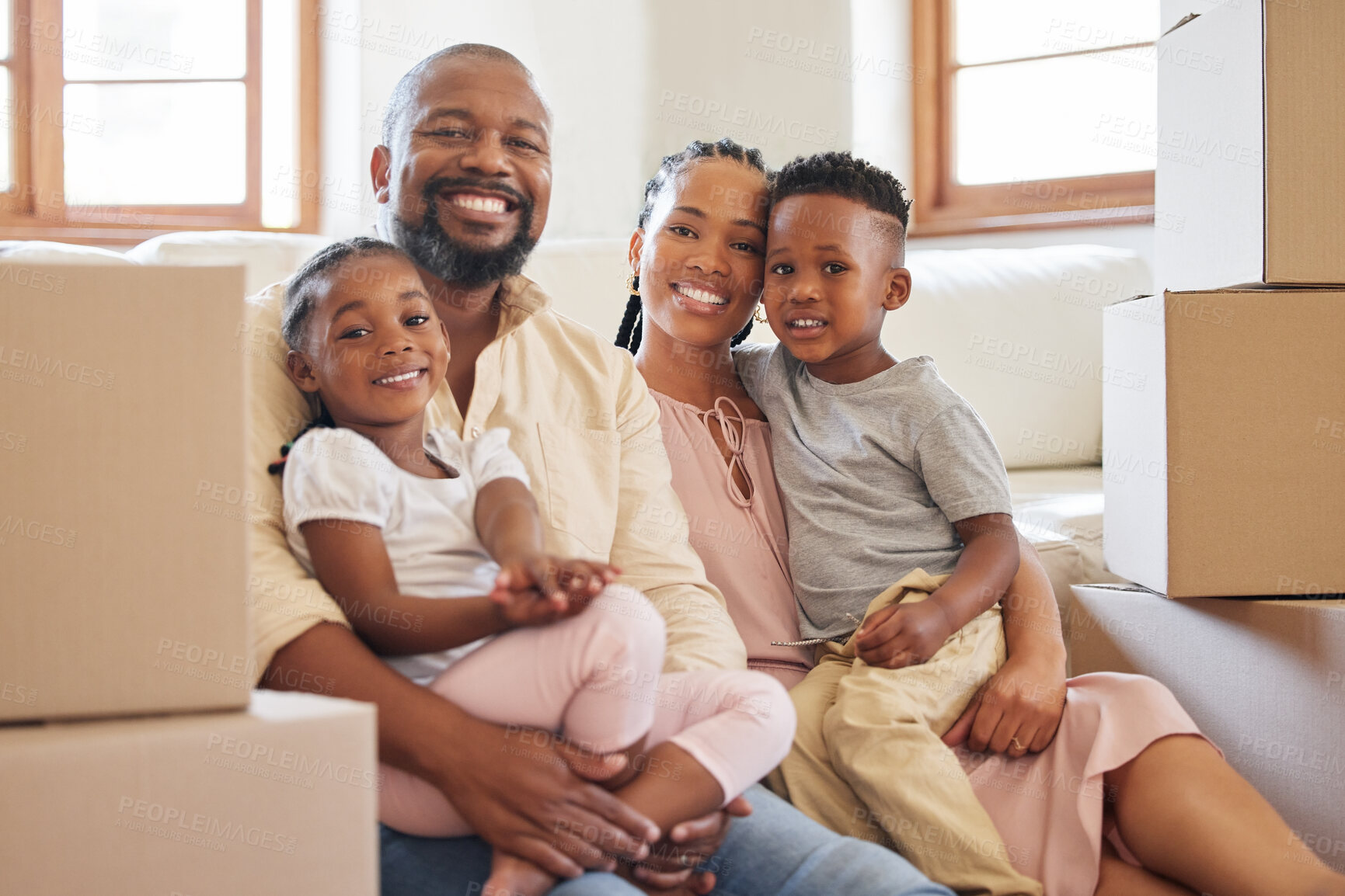 Buy stock photo Boxes, family portrait and kids on weekend for love, care and support for new home. Happy, African man and woman with children on floor for trust and together in lounge and pride for apartment  